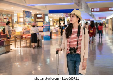 Visitor Standing In The Airport. Duty-free Shops In Taipei International Airport. 