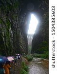 Visitor walk through the path at the Three Natural Bridges (Tianlong Bridge, Qinglong Bridge, Heilong Bridge) in The Wulong Karst National Geology Park (A UNESCO World Heritage Site in Chongqing)
