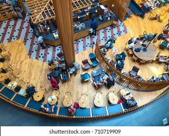 Visitors at the coffee shop in the shopping center in Stockholm, Sweden. Top view, from above - Shutterstock ID 710719909