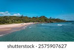 Visitors enjoying a sunny day at Kenting Baishawan beach in Taiwan with beautiful ocean views