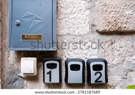 Visitors find secure boxes with keys along the street, offering a safe place to store their belongings conveniently.