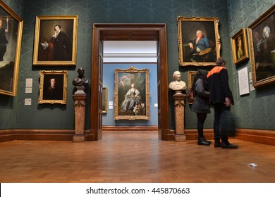 Visitors at London National Portrait Gallery with numerous paintings and two busts
Circa 2015 National Portrait Gallery London visitors admiring collection of paintings at world famous art gallery.