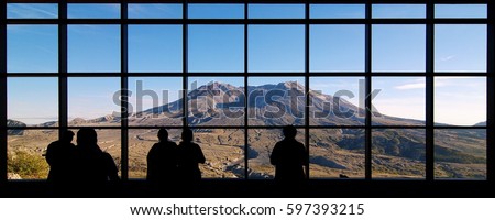 Visitors look at Mount St. Helens from the Johnston Ridge Observatory