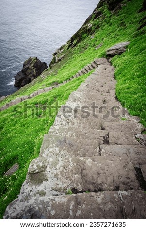 visitors on the steep path up to the monastery, Skellig Michael island, Mainistir Fhionáin (St. Fionan’s Monastery), county Kerry, Ireland, United Kingdom