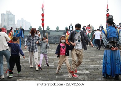 Visitors Take Part In A Fun Run During The Datang Games Held By The Ming Dynasty City Wall West Of The Arrow Tower In Xi 'an, Capital Of Northwest China's Xi 'an, Oct 1, 2022.