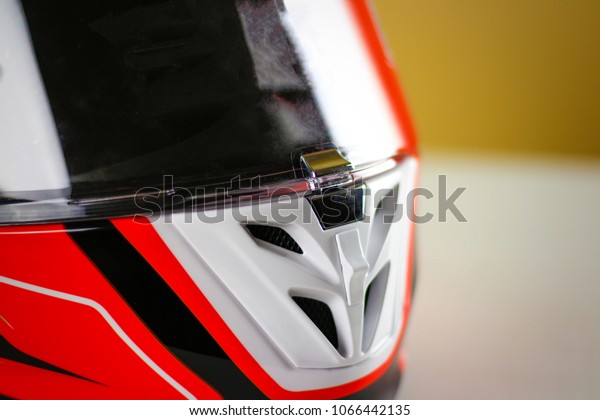 The visor on the helmet is closed on the lock.\
Moto helmet design. Close\
up.