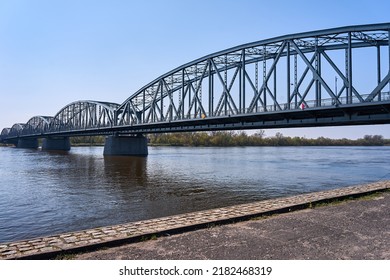 The Vistula River And The Steel Structure Of The Road Bridge In The City Of Torun, Poland