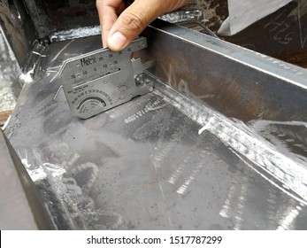 The visual inspection of welding was carried out by welding gauge to verify the fillet weld size, throat, leg, concave, convex and size of discontinuity, undercut was compliance to code and standard - Shutterstock ID 1517787299
