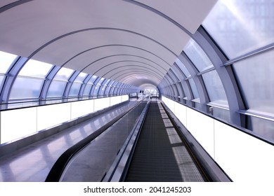 Visual Mockup For Long Advertising Banner Display On Moving Walkway Travelator In Long Pedestrain Tunnel. Blank Billboard Advertising Space For Mock Up Purpose; OOH In Situ Ad Placement