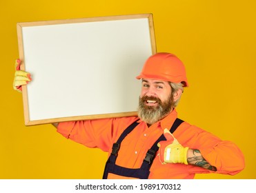 Visual outline. Troubleshoot concept. Bearded man repairman builder. Plan repair works. Repairman hold whiteboard copy space. Handsome repairman. Architect showing project. Professional repairman