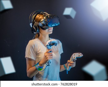 Visual reality concept.Young Asian woman using Visual reality or VR headset.Woman getting experience using VR-headset glasses.