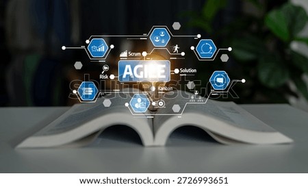 Visual representation of agile methodology featuring a book and illuminated icons that symbolize innovation, teamwork, and effective project management processes. Tessel