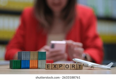 A visual representation of export with blocks, airplane, and mobile phone in a professional setting.