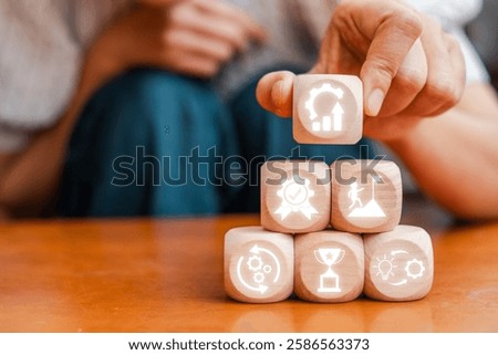 Visual representation of the Kaizen concept using wooden blocks symbolizing growth, efficiency, and continuous improvement.