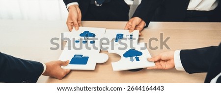 A visual representation of teamwork in computing, showcasing hands assembling puzzle pieces with cloud and data icons, symbolizing collaboration and business solutions. Amity