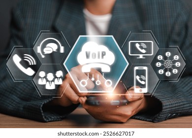 A visual representation of Voice over Internet Protocol (VoIP) technology, showcasing digital communication icons and a smartphone in a professional setting.