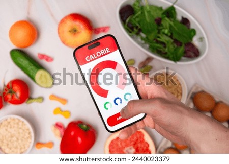 Visualization of a calorie tracking application amidst the backdrop of healthy eating. Care for your physique and proper diet. Calorie counting