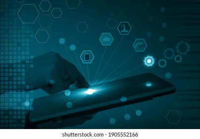 Visualization Of IIoT, Industrial Internet Of Things Or Industry 4.0. Hand Holding Tablet, Finger Touching Screen To Activate Sensors For Asset Management And Predictive Maintenance.