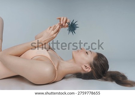 a visualization of a woman's self-perception, psychological state, negative emotions, female with a thistle flower