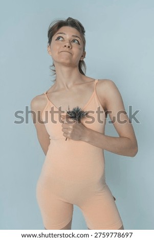 a visualization of a woman's self-perception, psychological state, positive emotions, female with a thistle flower