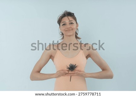 a visualization of a woman's self-perception, psychological state, positive emotions, female with a thistle flower