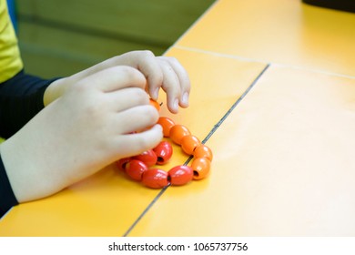 Visually Impaired Child Touching Bracelet For Sensation Close Up