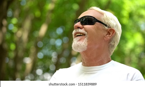 Visually Impaired Man In Sunglasses Listening Nature Sounds, Heightened Senses