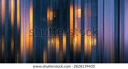 A visually striking abstract image featuring vertical stripes of light in warm orange and cool blue hues, suggesting a modern, energetic, and dynamic composition.