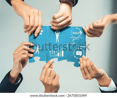 A visually striking image depicting multiple hands collaborating to assemble a puzzle with agile and growth symbols, emphasizing teamwork and strategic development. Amity