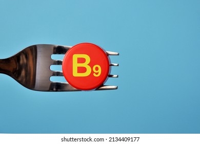Vitamin B9 on the fork. Food with a high content of vitamin B