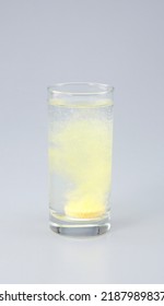 Vitamin C With B Complex , Calcium , Magnesium Tablet Dissolved In A Glass Of Water.