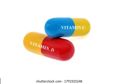 Vitamin C And D Capsules Close-up On White Background 