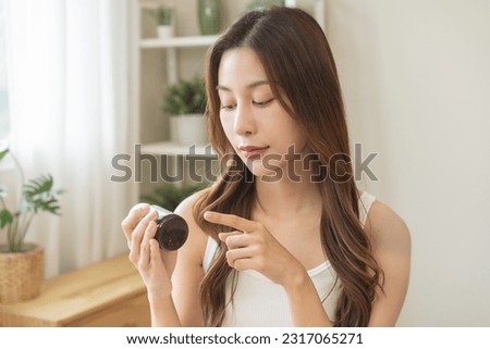 Vitamin C, fish oil, zinc tablet, health care treatment asian young woman holding medicine bottle reading label text about medical information, looking at medicine instructions side effects at home