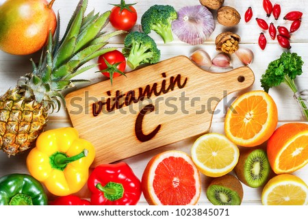 Vitamin C in fruits and vegetables. Natural products rich in vitamin C: oranges, lemons, dried fruits rose, red pepper, yellow pepper, kiwi, parsley leaves, garlic, tomatoes, walnuts, pineapple, mango