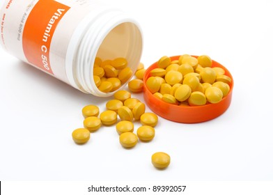 Vitamin C Pills Spilling Out Of A Jar