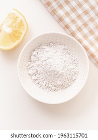 Vitamin C Powder Mask And Orange On White Background