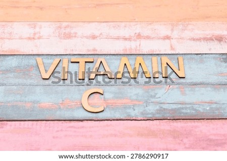 vitamin c write on rustical wooden background 