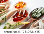 Vitamin capsules in a wooden spoon, soft gels, Fish oil capsules, omega 3, omega 9, vitamin D, vitamin E