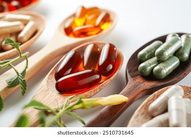 Vitamin capsules in a wooden spoon, soft gels, Fish oil capsules, omega 3, omega 9, vitamin D, vitamin E