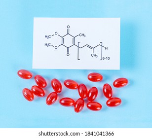 Vitamin Coenzyme Q10 With Chemical Formula On A Blue Background. To Prevent Aging. Pills And Medicine