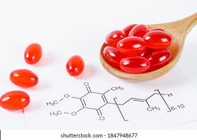 Vitamin Coenzyme Q10 With Chemical Formula On A White Background. To Prevent Aging. Pills And Medicine.