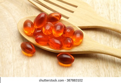  Vitamin, Coenzyme Q10  On The Wooden Spoon For Anti-aging.