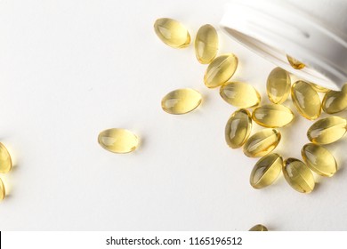 Vitamin D Gel Capsules. Vitamin D Bottle With Spilled Contents Isolated