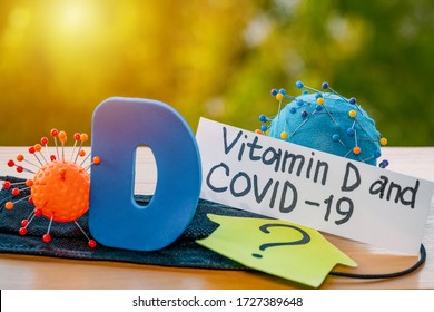 Vitamin D help in treating coronavirus. Vitamin D, coronavirus and question mark on a background of sunlight.