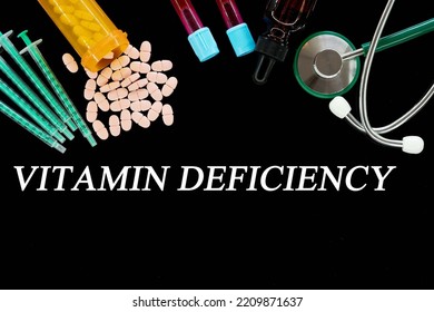 Vitamin Deficiency Text On Medical Background With Pills And Syringes Concept Of Human Disease