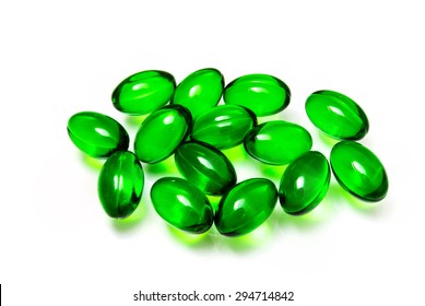 Vitamin E In Green Capsule In White Background