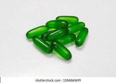 vitamin e softgel capsules on white background