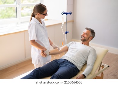 Vitamin Therapy IV Drip Infusion In Man Blood