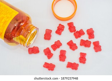 vitamins for children, such as jelly candies on a white background. vitamins in a jar on white - Shutterstock ID 1879237948