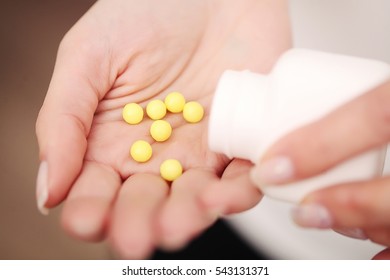 Vitamins And Supplements. Closeup Of Woman Hands Holding Variety Of Colorful Vitamin Pills. Close-up Handful Of Medication, Medicine Tablets, Capsules. Healthy Diet Nutrition Concept. High Resolution